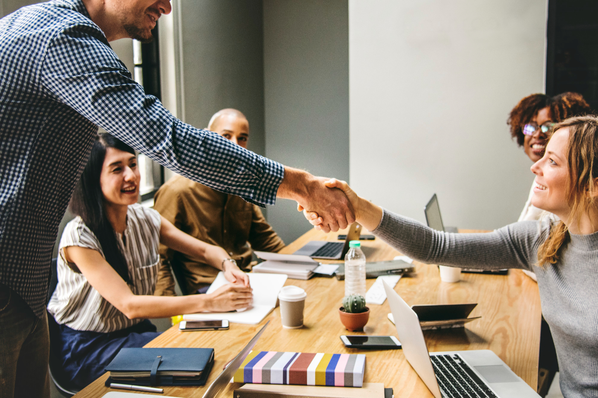 business-people-shaking-hands-agreement